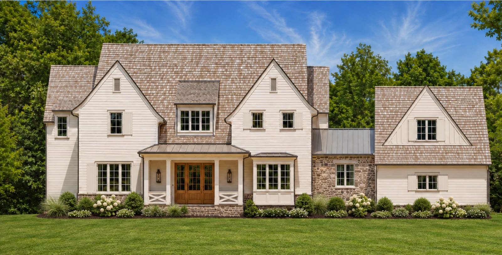 Front elevation of The Potter House, a shingle and stone country estate with steep gables, dormers and a central covered entry