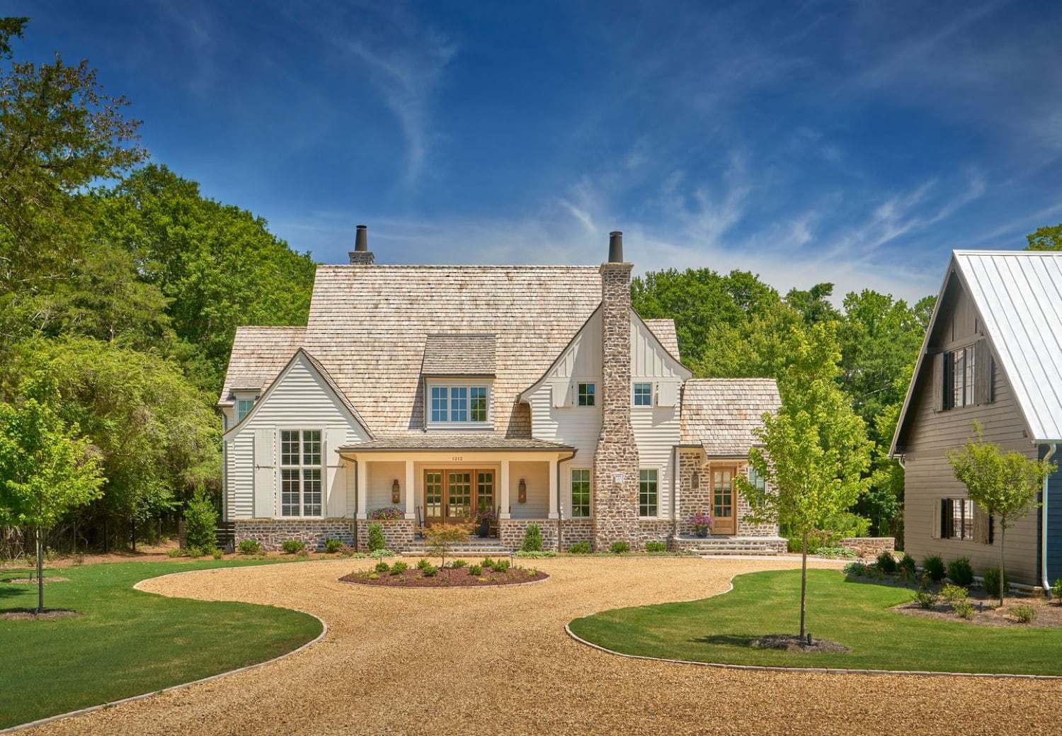 Front elevation of Potter House — a shingle and stone cottage with steep gables and dormers