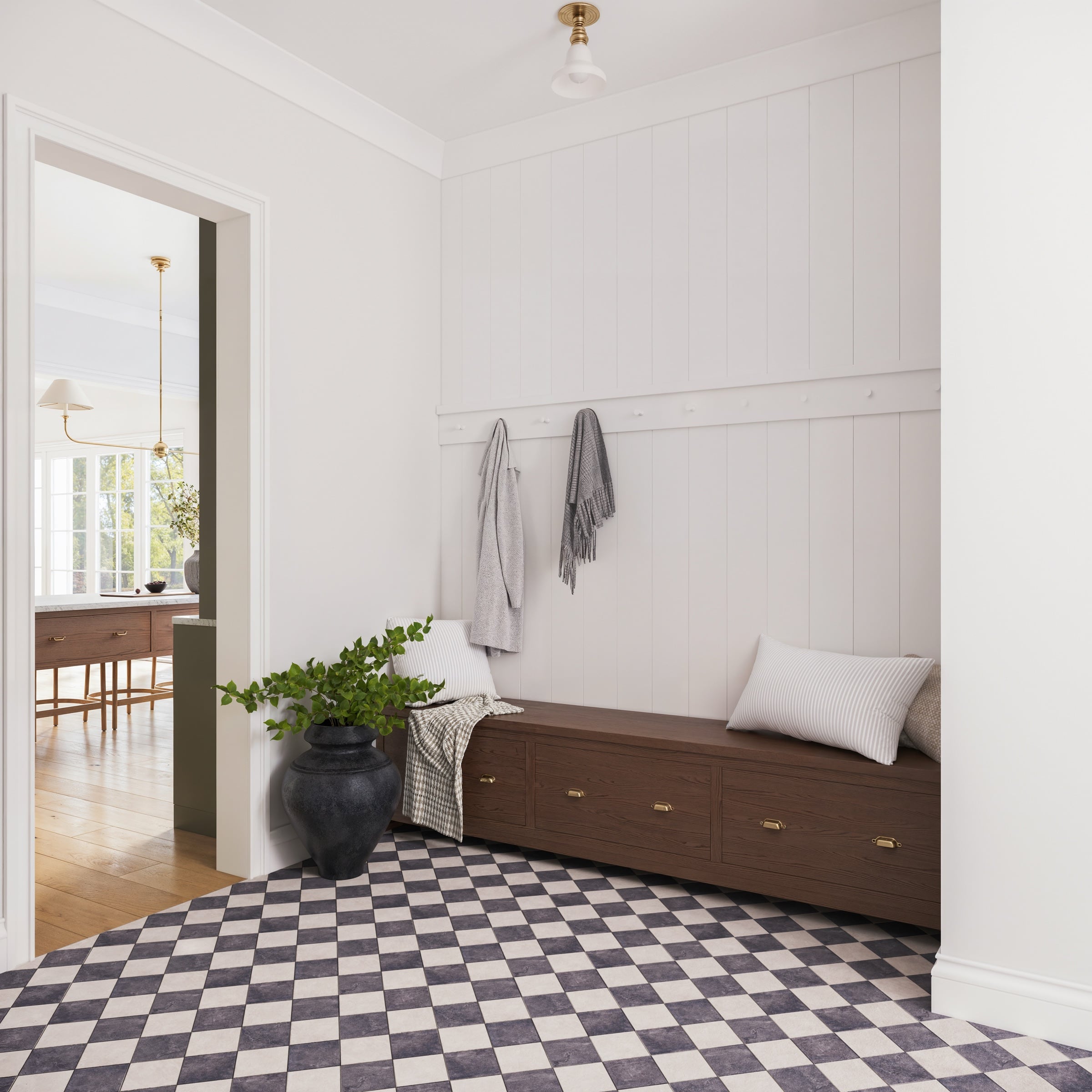 Mudroom at Stone Hollow Cottage with a checkerboard floor, built-in bench and paneled walls