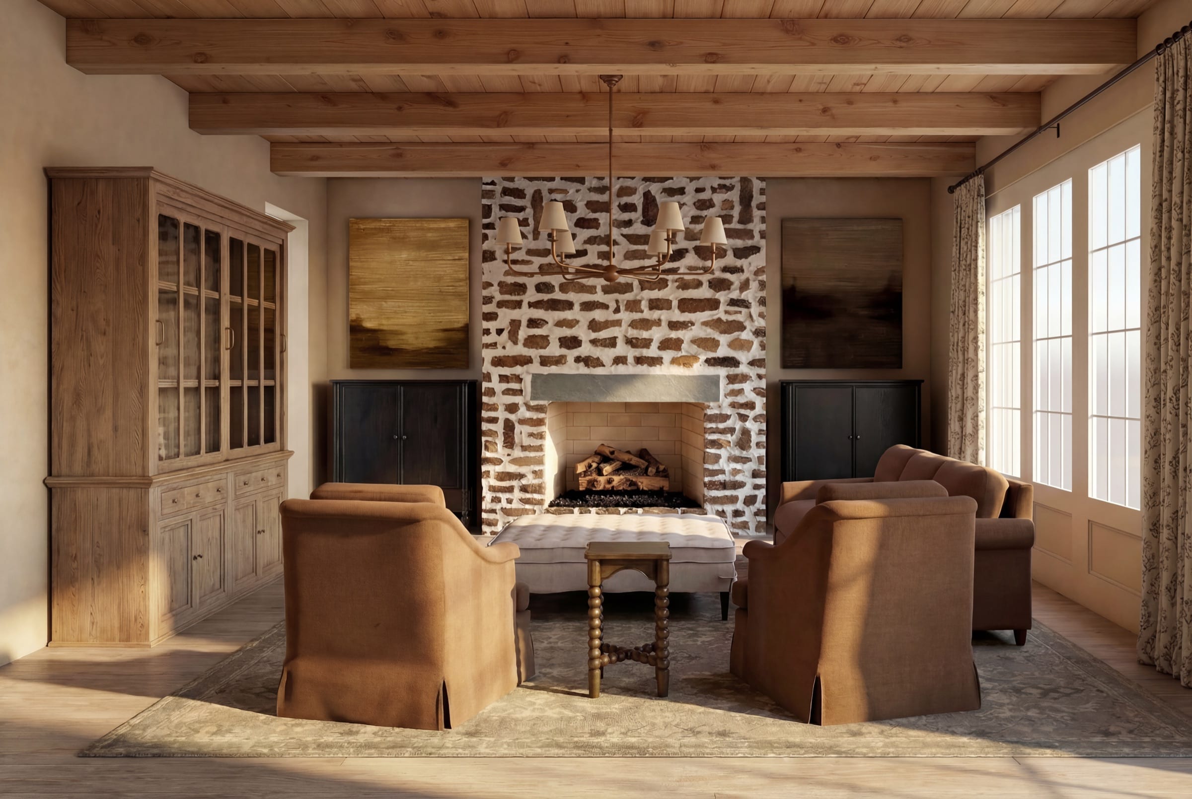 A family room at Wilson Farm with exposed timber beams and a stone fireplace